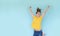 Happiness, freedom mockup. Smiling young woman jumping in the air on color background. Copy space for your banner text