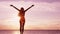 Happiness, freedom and success - Happy serene blissful woman raising arms up