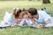 Happiness and harmony in family life. Happy family concept. Young mother and father with their daughter in the park. Happy family