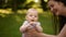 Happiness is a mother with a child in a summer park.