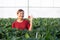 Happiness portrait entrepreneur young asian woman smile and holding strawberry in strawberry farm.