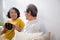 Happiness senior couple sitting on sofa cheer coffee cup and drinking in living room at home.