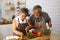 Happiness senior elderly couple having fun in kitchen with healthy food for working from home.