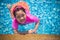 Happiness and Smiling Asian cute little girl has feeling funny and enjoy in swimming pool.