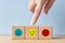 Happiness symbol, Positive mindset, joy index finger, next to wooden cubes with sadness and anger icons