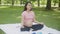 Happiness young asian woman pregnant sitting doing yoga with meditation lotus for relaxation.