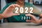 Happy 2022 new year, Hand holding 2022 start to new year score change 2021 growth number celebration 2022 of the tiger zodiac year