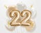 Happy 22th birthday gold foil balloon greeting background.