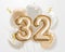 Happy 32th birthday gold foil balloon greeting background.