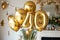 Happy 40th birthday. Gold helium 40 birthday balloons at a celebration event