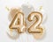 Happy 42th birthday gold foil balloon greeting background.