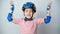 A happy 5-year-old boy in a protective helmet, elbow pads and gloves has fun