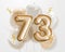 Happy 73th birthday gold foil balloon greeting background.