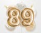 Happy 89th birthday gold foil balloon greeting background.