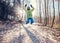 Happy active boy jumps in frozen park