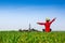 Happy active girl with bicycle enjoying the view on a green meadow