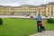 happy adorable children with their father travel in famous Schoenbrunn Royal Palace in Vienna Austria