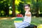 Happy adorable little kid girl reading book and holding different colorful books, apples and glasses on first day to