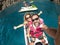 Happy adult couple have fun on jet sky activity escursion in summer holiday vacation at the sea - ocean active people take selfie