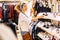 Happy adult woman portrait doing shopping in clothes store with shoes and shirts - shopping commecial center activity with trendy