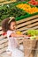 happy african american child sitting in shopping trolley in grocery