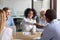 Happy african american colleagues partners handshake at team corporate meeting