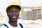 Happy african american construction worker at building site