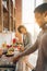 Happy african-american couple cooking dinner in kitchen