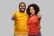 Happy african american couple showing thumbs up