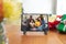 Happy african american family at christmas smiling on tablet video call interface screen