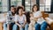 Happy African American family dad, mom and daughter having fun cuddle and video call on laptop on sofa at house. Self-isolation,