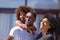 Happy African American family with daughter standing outdoor