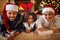 Happy African American family with Santa hats