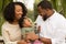 Happy African American family with their baby.