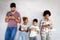 Happy african american family using technical devices, phone. tablet