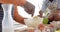 Happy african american grandfather and grandson baking in kitchen, slow motion