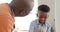 Happy african american grandfather and grandson talking, baking in kitchen, slow motion