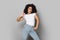 Happy african american millennial girl making stylish dancing pose.