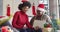 Happy african american mother and adult daughter in santa hats on christmas video call, slow motion