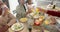 Happy african american multi generation family making a toast at thanksgiving dinner, slow motion