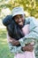 happy african american soldier in military uniform hugging girlfriend