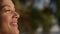 Happy african american woman enjoying warm golden sunlight outdoors portrait.