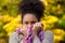 Happy african american woman posing with sweater and scarf