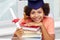 Happy african bachelor girl with books and diploma