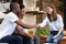 Happy african couple clients handshake insurer realtor making deal