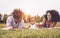 Happy African family enjoying together a weekend sunny day outdoor - Mother and father having fun with their daughter