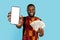 Happy African Man In Traditional Costume Holding Blank Smartphone And Dollar Cash