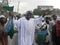 Happy African Muslim raising a flag