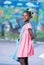 Happy afro american elementary female student entering school