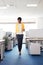 Happy afro american woman walking in office